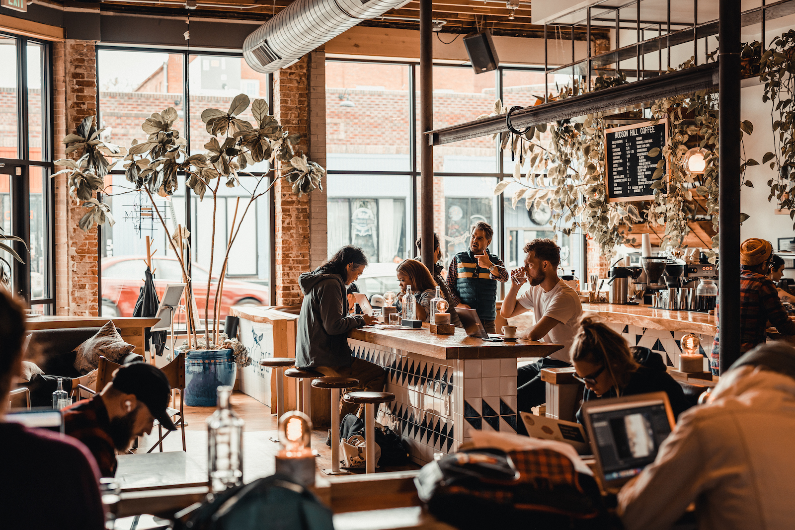 Warm neighborhood coffee shop with locals working